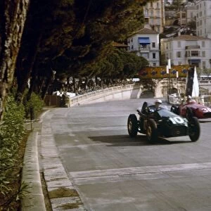 1957 Monaco Grand Prix: Stuart Lewis-Evans closely followed by Carlos Menditeguy. Lewis-Evans finished in 4th position on his Grand Prix debut