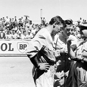 1958 Monaco Grand Prix: Roy Salvadori, Cooper T45-Climax, retired, and Jack Brabham, Cooper T45-Climax, 4th position, talk to a mechanic, portrait