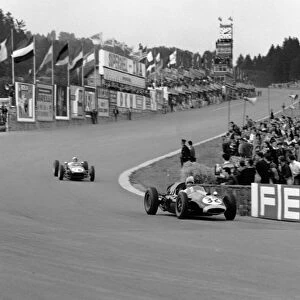1960 Belgian Grand Prix. Spa-Francorchamps, Belgium. 19th June 1960. Lucien Bianchi (Cooper T45-Climax), Not Classified, leads Alan Stacey (Lotus 18 - Climax), retired, action. World Copyright: LAT Photographic. Ref: 6659
