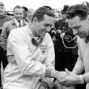 1960 British Grand Prix. Silverstone, Great Britain. 14-16 July 1960. Jack Brabham (Cooper T53-Climax), 1st position, with team owner John Cooper. Portrait. World Copyright: LAT Photographic Ref: Autosport b&w print