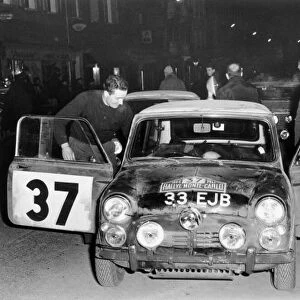 1964 Monte carlo Rally. Paddy Hopkirk and co-driver Liddonwith their winning Mini Copper