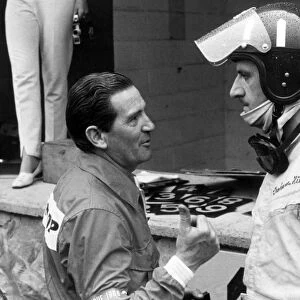 1966 Belgian Grand Prix - Graham Hill: Graham Hill, BRM P261, retired, in the pits after retiring, portrait, helmet