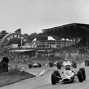 1966 British Grand Prix: Graham Hill, BRM P261, 3rd position, leads Jack Brabham, Brabham BT19-Repco, 1st position, Bruce McLaren, McLaren M2B-Serenissima