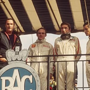 1968 British Grand Prix: Jo Siffert 1st position, his maiden Grand Prix win. Chris Amon 2nd position and Jacky Ickx 3rd position on the podium