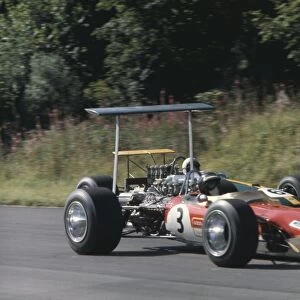 1968 International Gold Cup: Jackie Oliver, Lotus 49B Ford, leads Jack Brabham, Brabham BT26 Repco