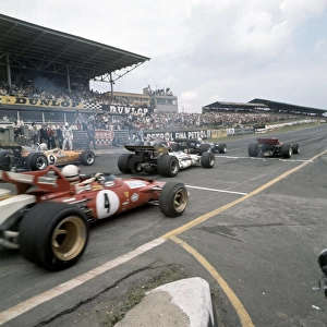 1970 British Grand Prix: Jochen Rindt, Lotus 72-Ford, 1st position, Jack Brabham, Brabham BT33-Ford, 2nd position, and Jacky Ickx, Ferrari 312B