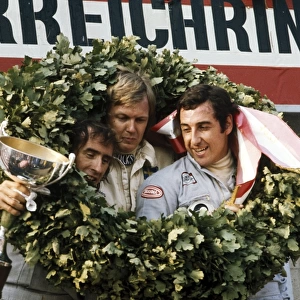 1973 Austrian Grand Prix: Ronnie Peterson, 1st position, with Jackie Stewart, 2nd position and Carlos Pace, 3rd position, podium, portrait