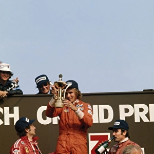 1975 Dutch Grand Prix - Podium: James Hunt, 1st position, with Niki Lauda, 2nd position and Clay Regazzoni, 3rd position on the podium, portrait