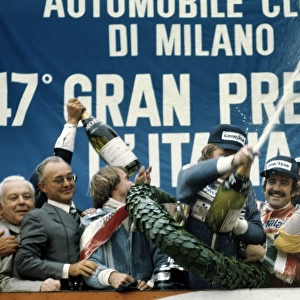 1976 Italian Grand Prix: Ronnie Peterson, 1st position, celebrates with Clay Regazzoni, 2nd position and Jacques Laffite, 3rd position, on the podium