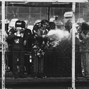 1976 Race of Champions: James Hunt, 1st position, on the podium with Alan Jones, 2nd position and Jacky Ickx, 3rd position, portrait