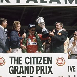 1976 South African Grand Prix - Podium: Niki Lauda, Ferrari, receives the winners trophy on the podium