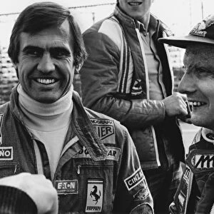 1977 Spanish Grand Prix: Jarama, Madrid, Spain. 6th - 8th May 1977. Carlos Reutemann and team mate Niki Lauda share a joke in the paddock, portrait