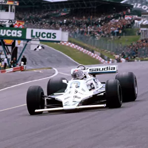 1980 British Grand Prix. Brands Hatch, England. 11-13 July 1980. Alan Jones (Williams FW07B Ford) 1st position at Paddock Hill Bend, with Nelson Piquet (Brabham BT49 Ford) behind. Ref-80 GB 17. World Copyright - LAT Photographic