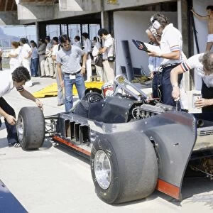 1981 Brazilian Grand Prix: Elio de Angelis in the pits during practice. The Lotus 88 was banned before qualifying
