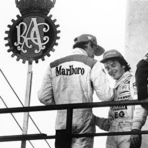 1981 Spanish Grand Prix: Gilles Villeneuve, 1st position, on the podium with John Watson, 3rd position, portrait