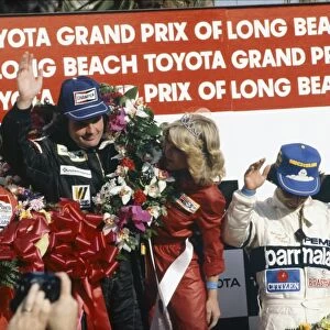 1981 United States Grand Prix West: Alan Jones, 1st position, Carlos Reutemann, 2nd position and Nelson Piquet, 3rd position, on the podium