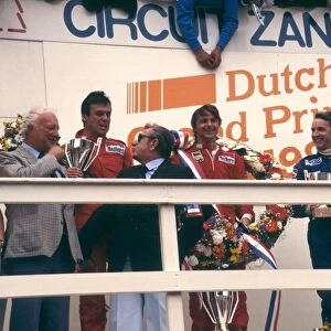 1983 Dutch Grand Prix: Rene Arnoux, 1st position, Patrick Tambay, 2nd position and John Watson 3rd position on the podium