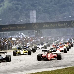 1984 Brazilian Grand Prix: Michele Alboreto, retired leads Elio de Angelis, 3rd position, at the start of the formation lap, action