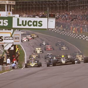 1985 European Grand Prix: Ayrton Senna leads Nigel Mansell on the climb upto Paddock Hill Bend at the start