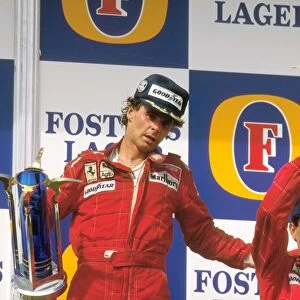 1987 Australian Grand Prix: Gerhard Berger, 1st position gives teammate Michele Alboreto, 3rd position a pat on the back whilst on the podium