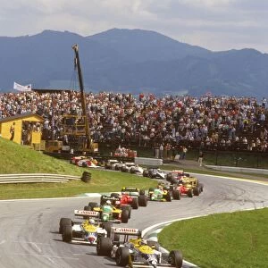 1987 Austrian Grand Prix: Nelson Piquet leads teammate Nigel Mansell, Teo Fabi and Gerhard Berger at the start. Ref-87 AUT 04