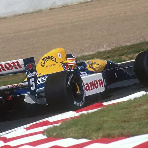 1991 French Grand Prix. Magny-Cours, France. 5-7 July 1991. Nigel Mansell (Williams FW14 Renault) 1st position. Ref-91 FRA 10. World Copyright - LAT Photographic