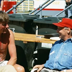 1992 Australian Grand Prix: Former World Champions, James Hunt and Niki Lauda chat in the paddock, portrait