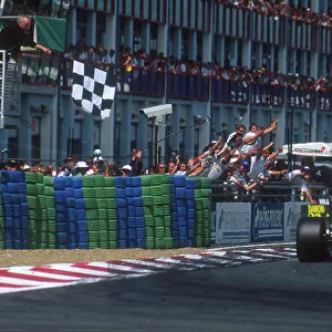 1993 French Grand Prix. Magny-Cours, France. 2-4 July 1993. Alain Prost (Williams FW15C Renault) takes the chequered flag for 1st position just ahead of teammate Damon Hill (Williams FW15C Renault)