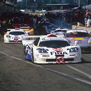 1997 Le Mans 24 hours. Le Mans, France. 14th - 15th June 1997. Roberto Ravaglia / Eric Helary / Peter Kox (McLaren F1 GTR), 3rd overall and 2nd in Class, leave the pit lane, action. World Copyright: LAT Photographic
