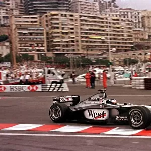 1998 MONACO GP. Mika Hakkinen, McLaren Mercedes, enters the swimming pool section a couple of seconds clear of his team mate David Coulthard on lap 1 of the race. Photo: LAT