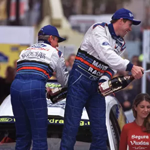 2000 World Rally Championship Catalunya Rally, Spain 30 March - 2 April 2000 Colin Mcrae and Nicky Grist (Ford Forcus WRC) 1st Position. Mcrae and Grist celebrate on the podium. World Copyright LAT Photographic