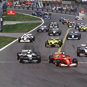 2001 Canadian Grand Prix Montreal, Canada. 8th-10th June 2001 Michael Schumacher, Ferrari F2001, leads brother Ralf Schumacher, BMW Williams FW23, and David Coulthard, West McLaren Mercedes MP4/16