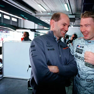2001 European Grand Prix Adrian Newey talks with Mika Hakkinen, McLaren Nurburgring