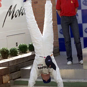 2001 European Touring Cars - Super Production Jarama, Spain. 30th September 2001. A handstand by Tommy Rustad (Nissan Primera Mark 3) to celebrate race victory. World Copyright: Photo 4 / LAT Photographic ref: Digital Image Only