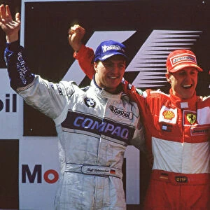 2001 French Grand Prix Magny Cours, France. 29th June - 1st July 2001. Race podium. Ralf Schumacher, BMW Williams FW23 (2nd), Michael Schumacher, Ferrari F2001 (1st) and Rubens Barrichello
