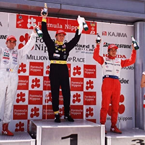 2001 Japanese Formula 3 Championship Suzuka, Japan. 1st July 2001. Race podium, 1st Paolo Montin (TOMS), 2nd Benoit Treluyer (Mugen Dome Project), 3rd Sakon Yamamoto (TOMS). World Copyright: Yasushi Ishihara / LAT Photographic ref: Digital Image Only