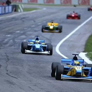 2002 FIA F3000 Championship San Marino. Italy. 13th April 2002 Race winner, Sebastian Bourdais (Super Nova Racing) leads Rodrigo Sperafico (Durango Formula) 2nd