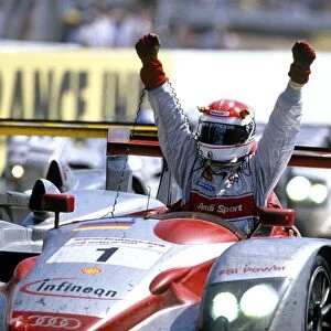 2002 Le Mans 24 hours: Frank Biela / Tom Kristensen / Emanuele Pirro, 1st position, Pirro takes the chequered flag and salutes a Audi 1st, 2nd and 3rd positions