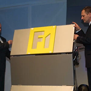 2002 Renault F1 Launch Mike Gasvoigne and Jean Jacques His unveil the RS22 Paris, France. 27th January 2002. Launch of the Mild Seven Renault F1 R202. Photo: LAT Photographic file Ref: 8. 9Mb Digital File