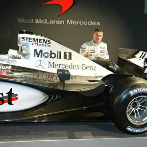 2002 West McLaren Mercedes Launch Kimi Raikkonen and David Coulthard with the new MP4-17 Circuit de Catalunya, Barcelona, Spain. 19th January 2002 World Copyright - Jennings/LAT Photographic ref: 11.7 MB Digital Image
