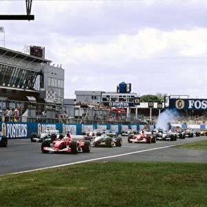 2003 British Grand Prix Silverstone, England. 18th - 20th July 2003. Rubens Barrichello, Ferrari F2003 GA, leads Jarno Trulli, Renault R23, at the start of therace. World Copyright: Peter Spinney / LAT Photographic ref: 35mm Image 03GB03