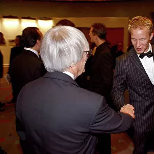 2004 FIA Awards Dinner Monte Carlo, Monaco. 11th December 2004 Bernie Ecclestone shakes hands with Petter Solberg. Portrait. World Copyright: Malcolm Griffiths/LAt Photographic ref: Digital Image Only