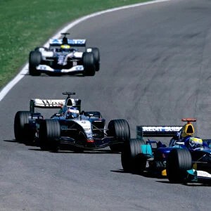 2004 San Marino Grand Prix. Imola, Italy 23rd - 25th April 2004 Giancarlo Fisichella, Sauber Petronas C23 leads Kimi Raikkonen, McLaren Mercedes MP4 / 19 and Zsolt Baumgartner, Minardi Cosworth PS04B. Action