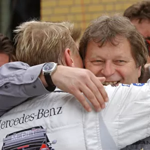 2005 DTM Championship EuroSpeedway Lausitz, Germany. 30th April - May 1st 2005. Norbert Haug congratulates Mika Hakkinen (AMG-Mercedes C-Klasse) on his third place finish
