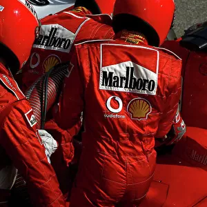 2005 Formula One Testing Barcelona, Spain. 17th February 2005. Michael Schumacher, Ferrari F2004M, pitstop practice. World Copyright: Malcolm Griffiths/LAT Photographic ref: Digital Image Only