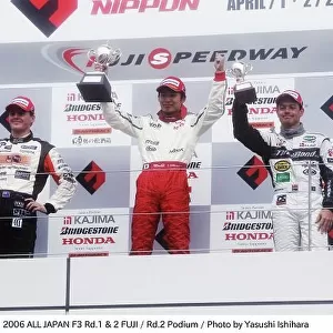 2006 All - Japan F3 Championship. Fuji Speedway. Fuji. 2nd April 2006 Kazuya Oshima (TDP Tom's F305 Dallara) celebrates victory on the podium with Jonny Reid (Inging F306) and Fabio Carbone (Three Bond Dallara F305)
