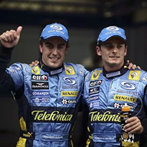 2006 Chinese Grand Prix - Saturday Qualifying Shanghai International Circuit, Shanghai, China. 28th September - 1st October 2006. Fernando Alonso, Renault R26, and Giancarlo Fisichella, Renault R26, celebrate their 1-2 in qualifying