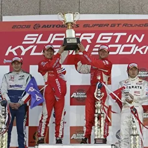 2006 Japanese Super GT Series Autopolis, Japan. 15th October 2006 GT 500 podium - winners, Satoshi Motoyama / Tsugio Matsuda (XANAVI NISMO Z) 1st position. Ryo Michigami / Takashi Kogure (TAKATA DOME NSX) 2nd position