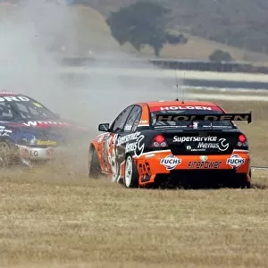 2006 V8 Supercar Championship Phillip Island, Melbourne, Victoria. 8th - 10th December. Jason Richards (Tasman Motorsport Holden Commodore VZ) and Jamie Whincup (Team Betta Electrical Holden Commodore VZ) collide