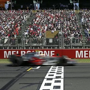 2007 Australian Grand Prix - Sunday Race Albert Park, Melbourne, Australia. 18th March 2007. Lewis Hamilton, McLaren MP4-22 Mercedes, 3rd Position, crosses the line to take his first podium in his debut F1 race. Finishes. Action